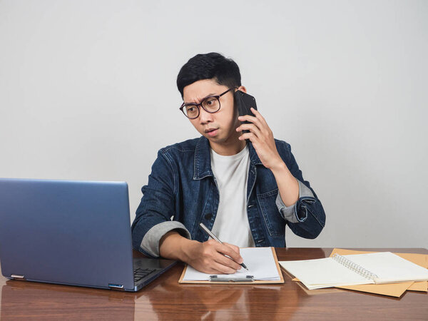 Young man work hard at his workplace table