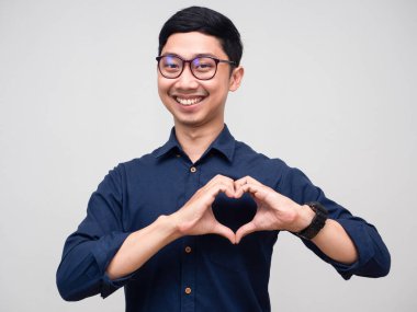 Positive businessman cheerful smile show hand heart portrait