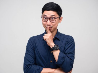 Shh,Asian man businessman wear glasses gesture shush