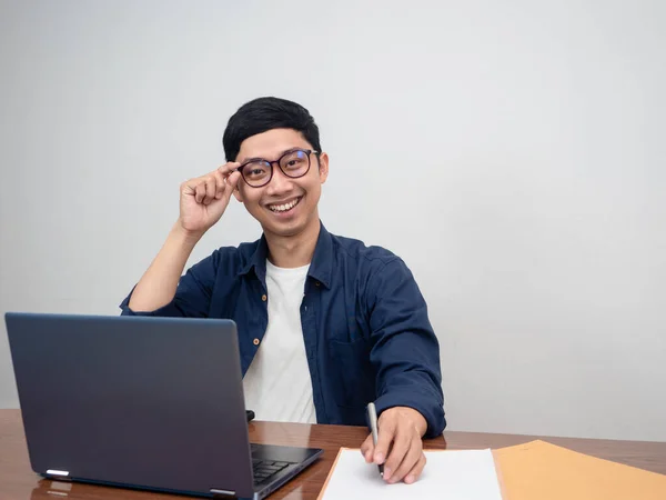 Businessman wear glasses smile sitting at working table