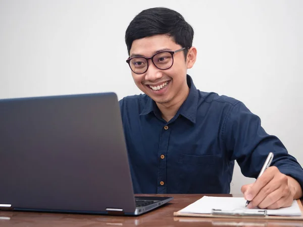 Young businessman happy with working at workplace table