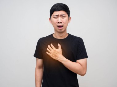 Asian man touch his chest feels pain his heart,Man heart disease