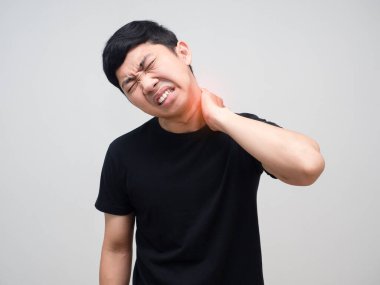 Young man feels pain his neck from office syndrome