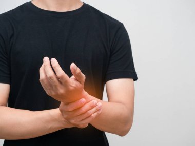 Close up man pain his wrist isolated studio shot