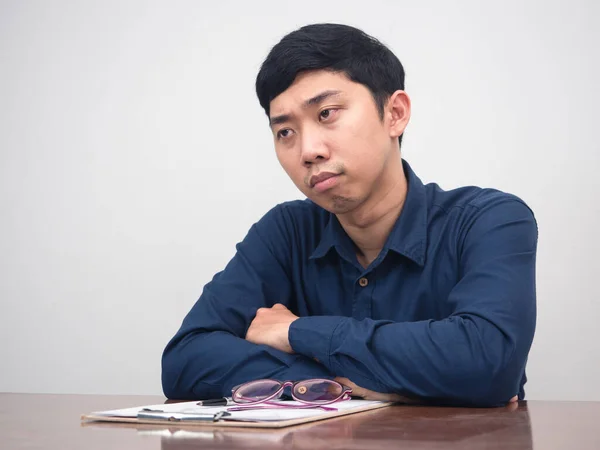 Asian man feels sadness about lay off employee sit at working table