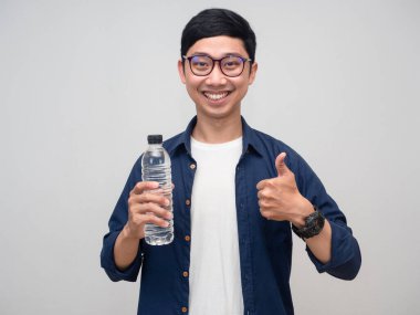 Asian man happy smile hold water bottle and thumb up isolated