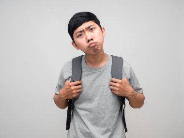 Asian man with backpack feels confused and doubt isolated