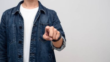 Close up man jeans shirt point finger at you isolated