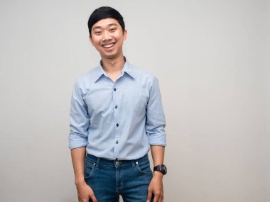 Young asian man gentle smile standing studio shot white background