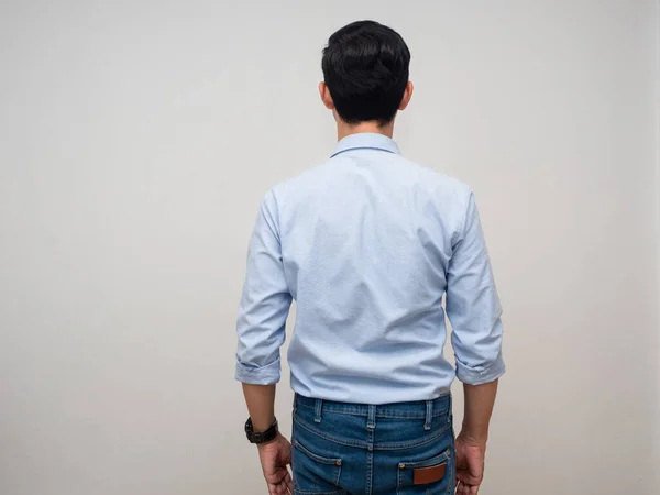 Backside of businessman blue shirt,Man standing turn back white background