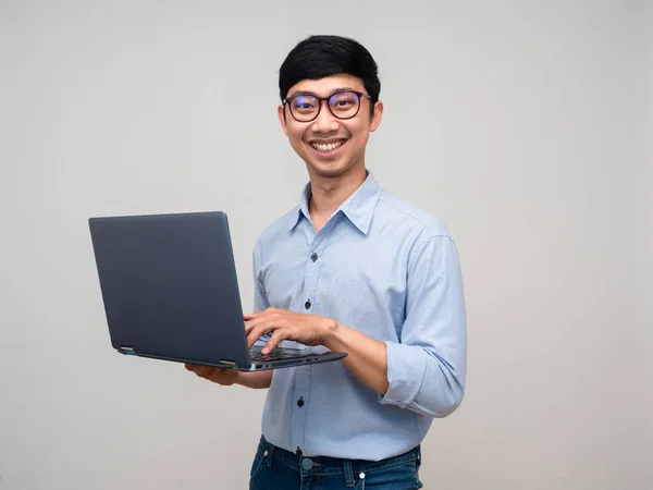 Portrait asian businessman happy smile holding laptop for working isolated
