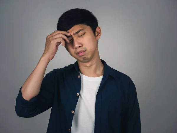 Asian man feels depressed and crying about unhappy life isolated
