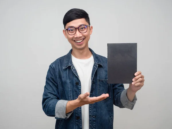 Positive man wear glasses jeans shirt gentle smile gesture suggest the book isolated