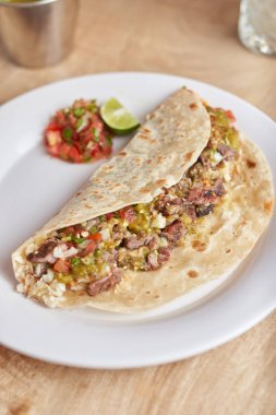 Mexican taco with salsa, taco al pastor