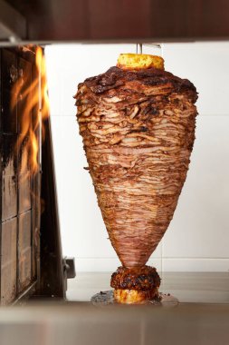 delicious trompo al pastor (shepherd's style). Mexican taco with salsa, taco al pastor