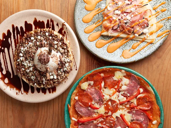 picture of delicious crepe, chocolate ice cream waffle and pizza.