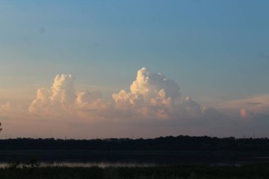 a beautiful view of the sky and the clouds of the rising storm