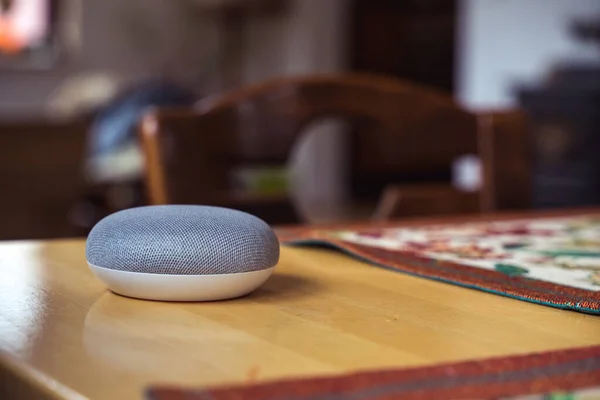 voice controlled smart speaker in a interior home environment.