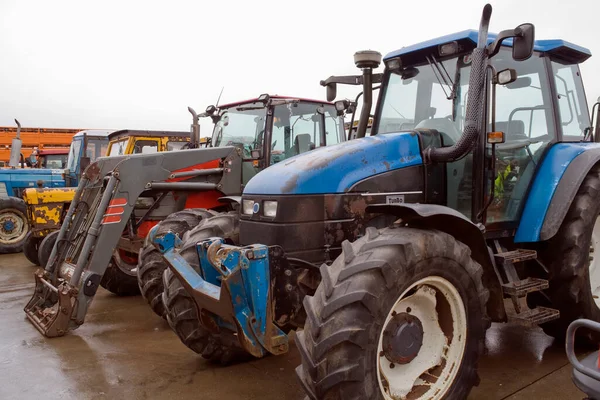 A tractor is an engineering vehicle specifically designed to deliver a high tractive effort (or torque) at slow speeds, for the purposes of hauling a trailer or machinery such as that used in agriculture, mining or construction.