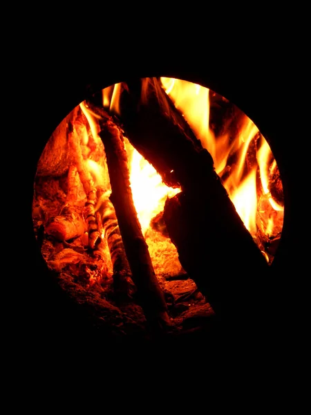Bright Yellow Fire Burns Black Wood Hole Cast Iron Stove — Stock fotografie