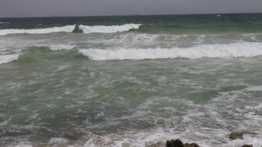 Sea waves impact rocky on the beach. Supper slow motion High Frame Rate video. 