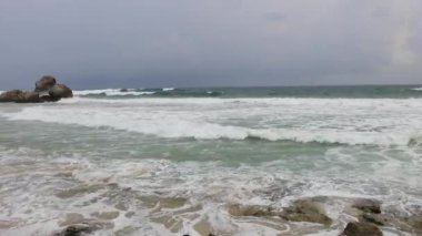 Fantastic Rocky coast. Sea waves impact rocky on the beach. Full HD Video