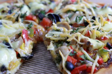 Delicious pizza slices with tasty cheese falling from 