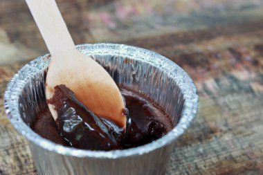 Chocolate Lava dessert on wooden background with spoon