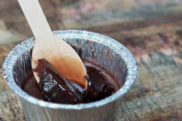 Chocolate Lava dessert on wooden background with spoon
