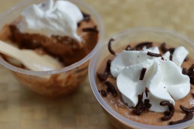 Delicious silky smooth chocolate mousse decorated with whipping cream
