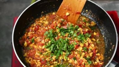  Egg, tomato, chilli, vegetable cooking in fry-pen. Super Slow motion