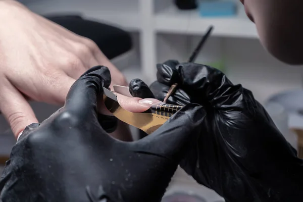 The process of manicure in a beauty salon close-up