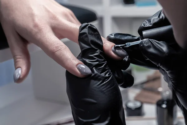 The process of manicure in a beauty salon close-up
