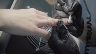 The process of manicure in a beauty salon close-up