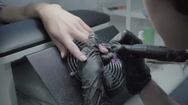 The process of manicure in a beauty salon close-up
