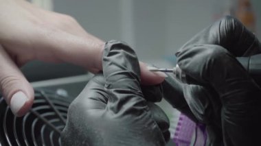 The process of manicure in a beauty salon close-up