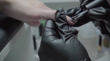 The process of manicure in a beauty salon close-up
