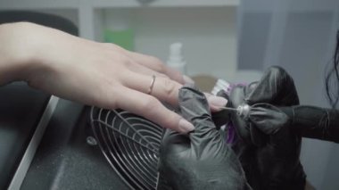 The process of manicure in a beauty salon close-up