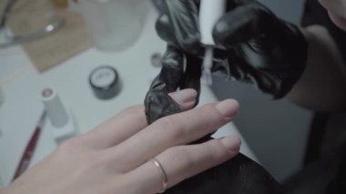 The process of manicure in a beauty salon close-up