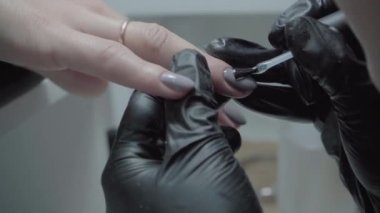 The process of manicure in a beauty salon close-up