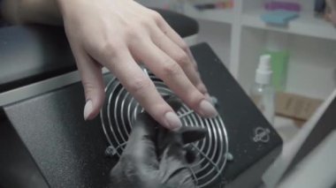 The process of manicure in a beauty salon close-up