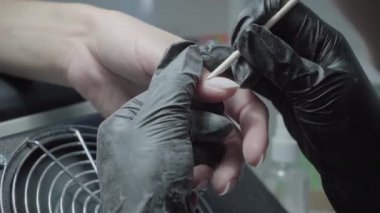 The process of manicure in a beauty salon close-up