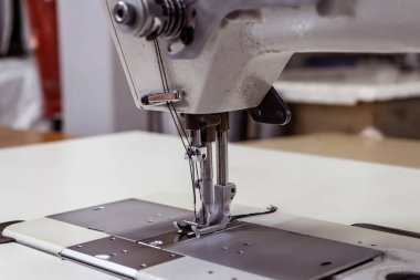 Sewing machine needles close-up in the workshop