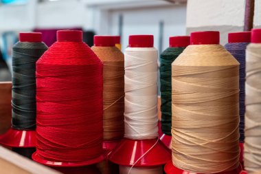 Threads of different colors in the workshop