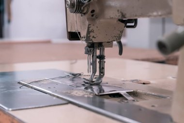 Sewing machine needles close-up in the workshop