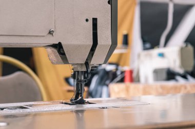 Sewing machine needles close-up in the workshop