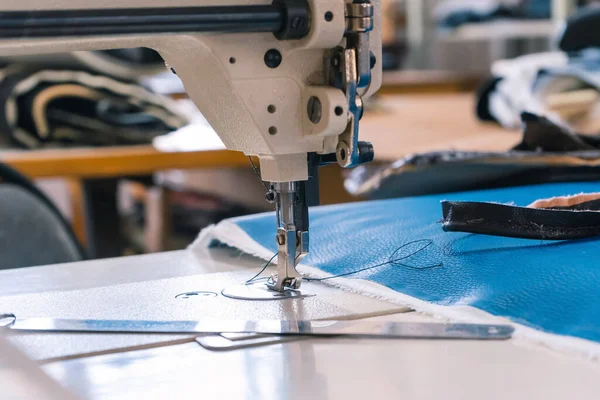 Sewing machine needles close-up in the workshop