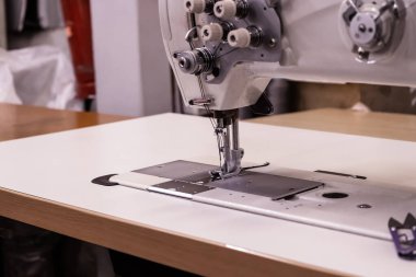 Sewing machine needles close-up in the workshop