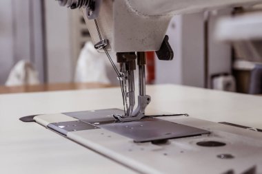 Sewing machine needles close-up in the workshop