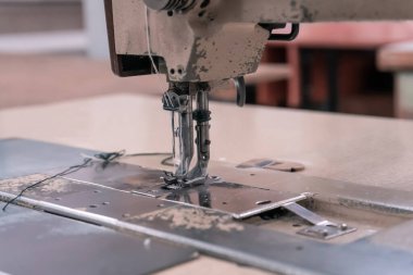 Needles of an old sewing machine close-up in the workshop